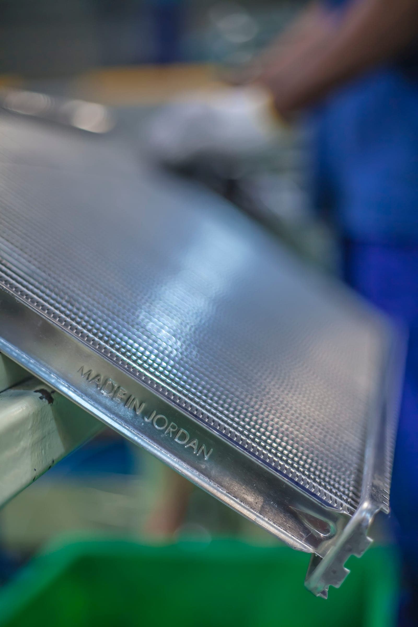 Macro close-up of a Made-in-Jordan condenser core stamped at the base