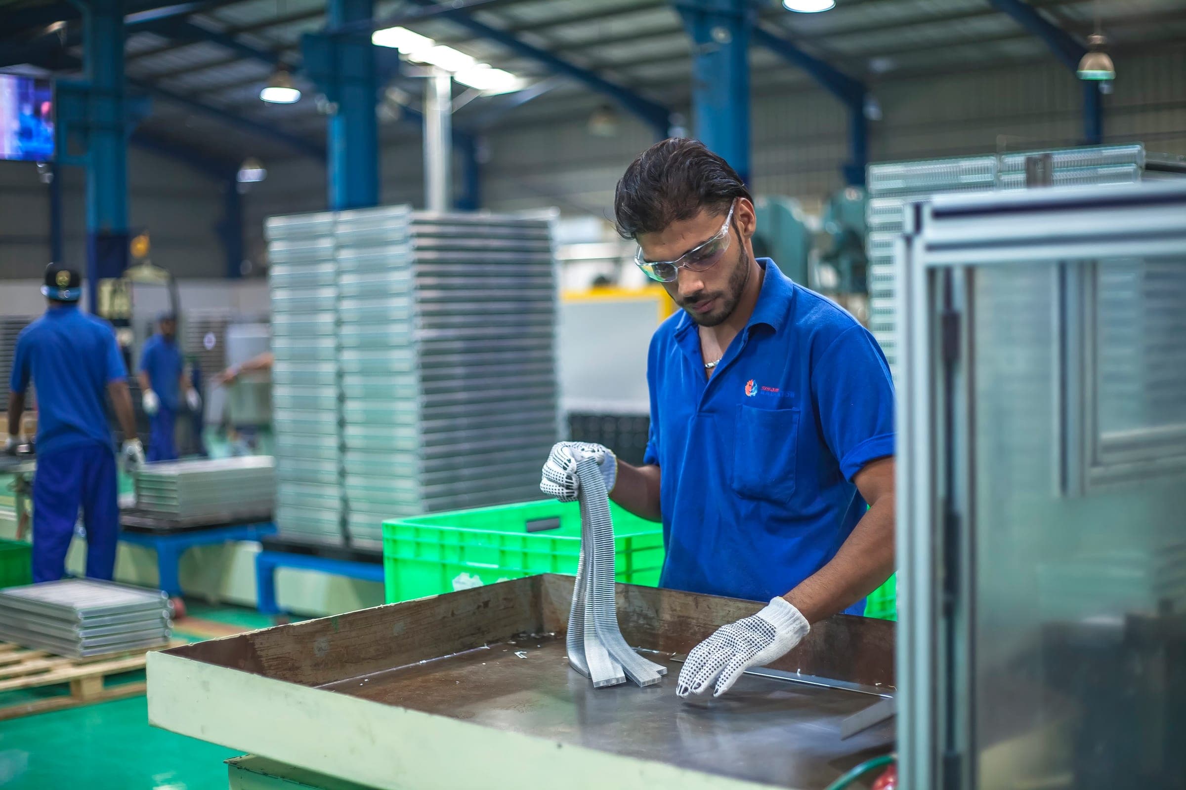 Operator running a corrosion-bath test on an Automoty cooler core